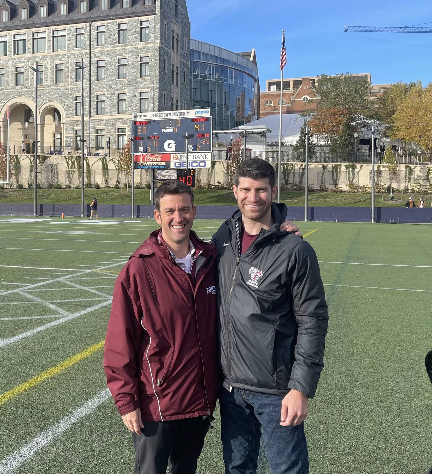Dr. Goldwaser in a Fordham jacket on the football field