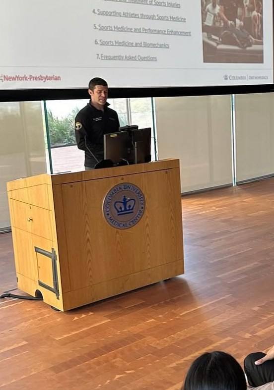 Dr. Goldwaser lecturing from a Columbia University Medical Center podium