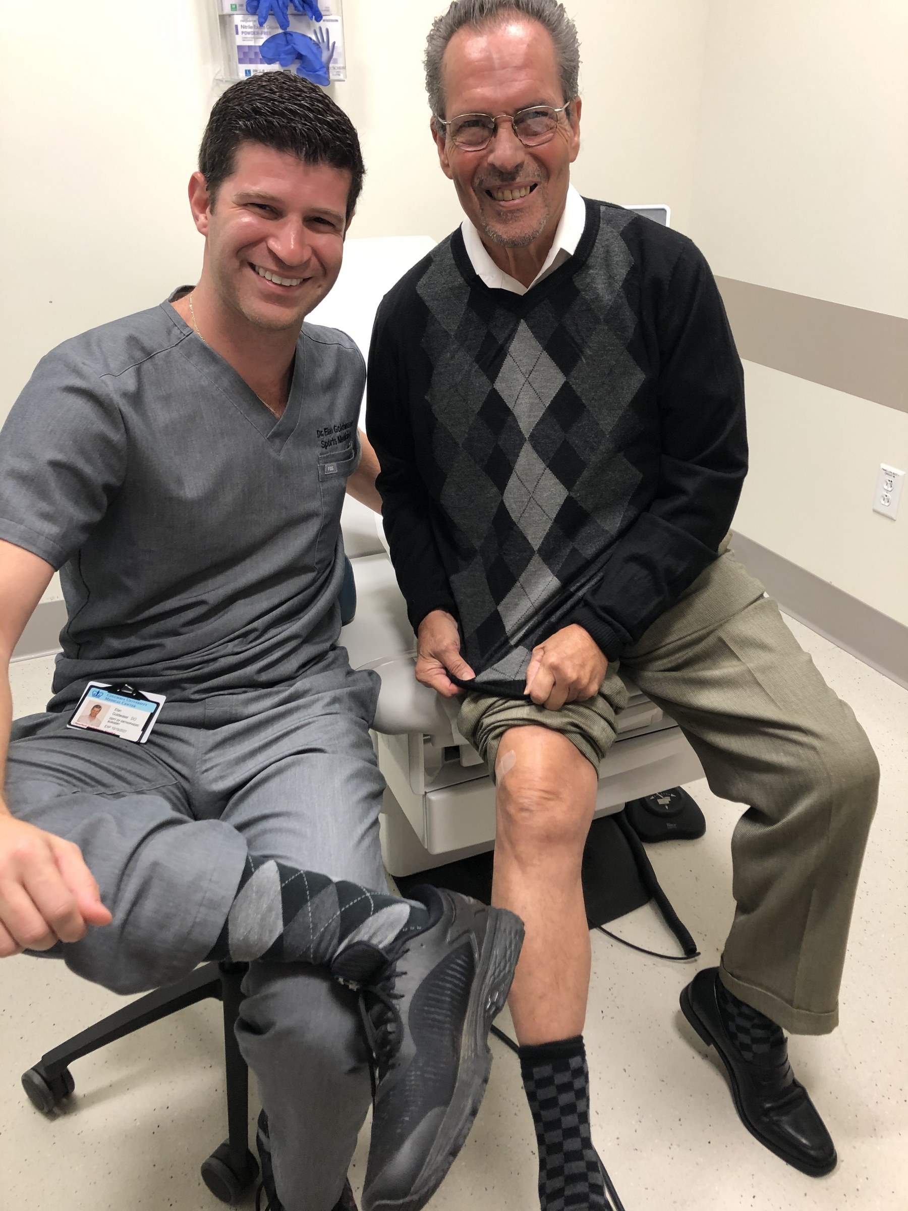 Dr. Goldwaser with a patient during a procedure visit